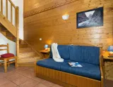 Rozkladací gauč v obývačke v rezidencii Lodges des Alpages